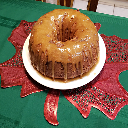This indulgent cake is crafted with a combination of high-quality components and finished with a tantalizing caramel glaze.